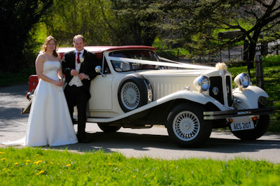 Couple with the Wedding Car