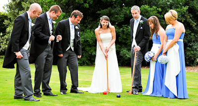 Wedding Couple playing croquet